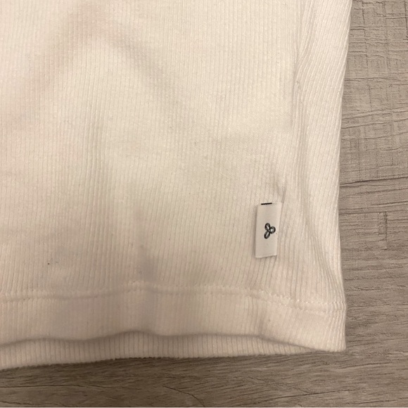 This a white long sleeve, TNA shirt that is still in the stores to this day - Picture 2 of 5